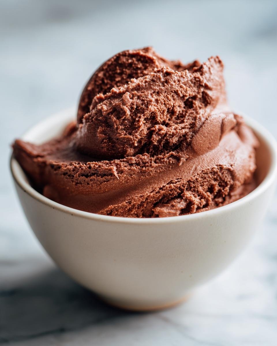 A bowl of rich and creamy 5 Minute Keto Chocolate Mousse Delight, perfect for a quick dessert.