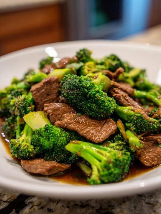 Close-up of a flavorful beef and broccoli recipe, featuring tender slices of beef and vibrant green broccoli florets in a savory sauce.