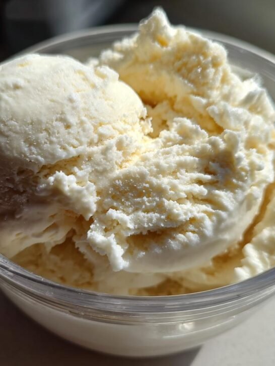 A clear bowl filled with creamy vanilla ice cream, perfect for Ninja Creami recipes.