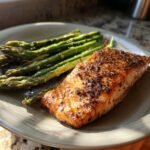 A perfectly cooked salmon fillet with seasoned asparagus, showcasing one of the best easy dinner recipes.