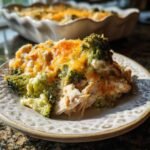 A serving of Delicious Easy Low Carb Chicken Casserole with broccoli and melted cheese on a decorative plate.