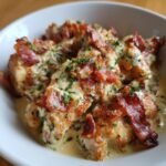 Close-up of creamy chicken and bacon bites, garnished with parsley, a perfect addition to irresistible chicken and bacon recipes.