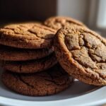 Close-up of stacked Soft Chewy Christmas Gingerbread Cookies with cracked, sugary tops.