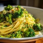 Close-up of vibrant Broccoli Chickpea Pasta With Garlic Olive Oil, tossed with herbs and breadcrumbs.